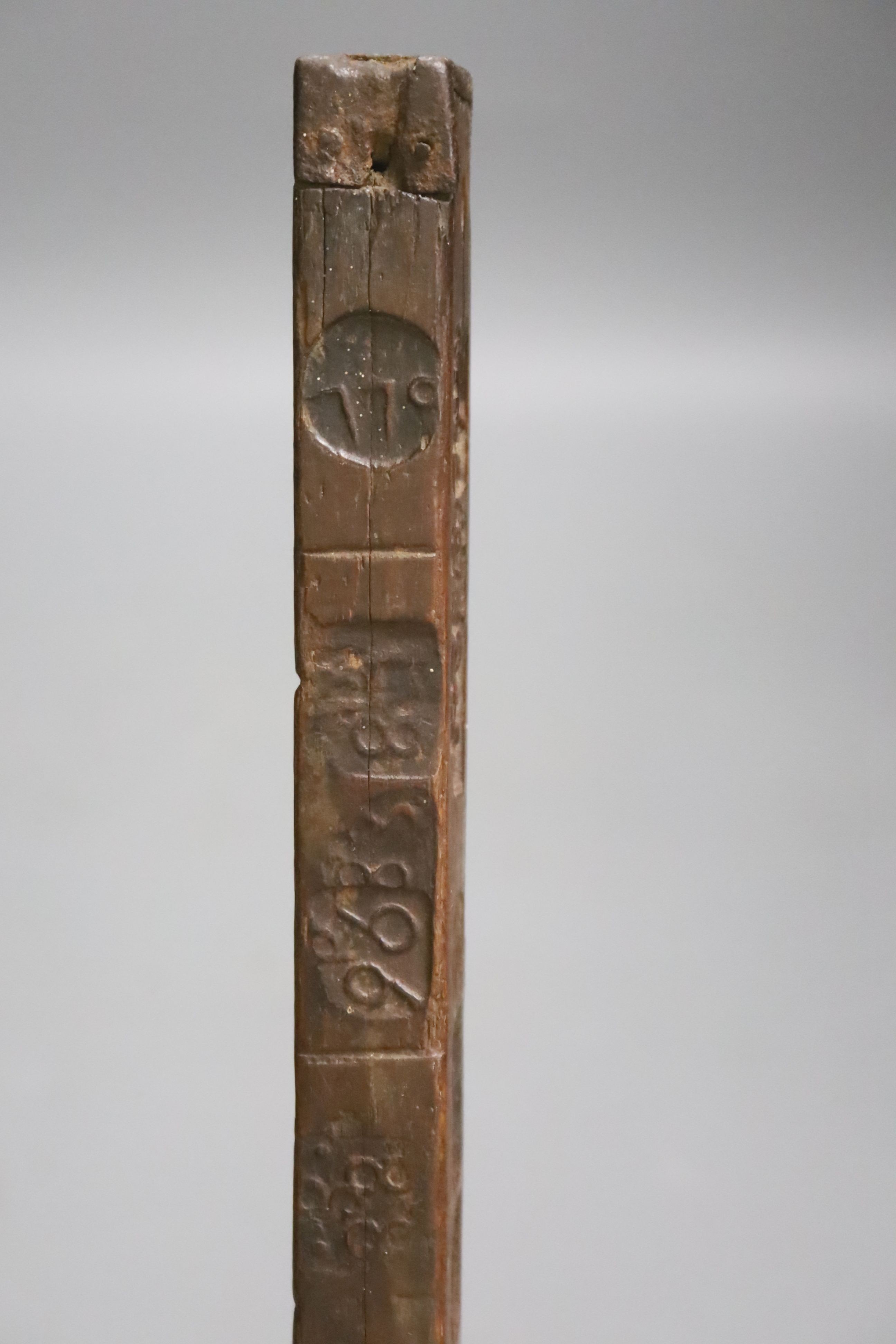 An unusual 18th/19th century rule/gauge or tally stick with impressed numerals, 26cm long